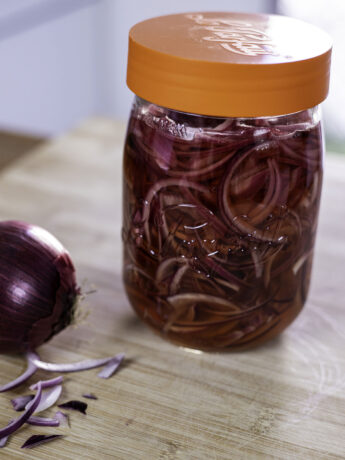 Pickled red onions in a jar