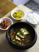 Kimchi Jigae, spicy stew with kimchi, pork belly and rice
