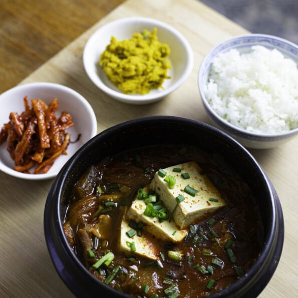 Kimchi Jigae, spicy stew with kimchi, pork belly and rice