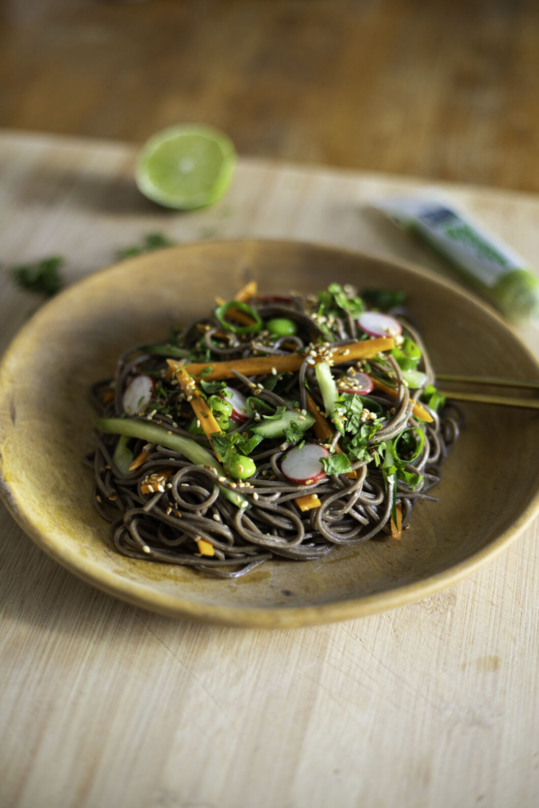 veggie soba noodle salad with carrots and cucumbers and radishes