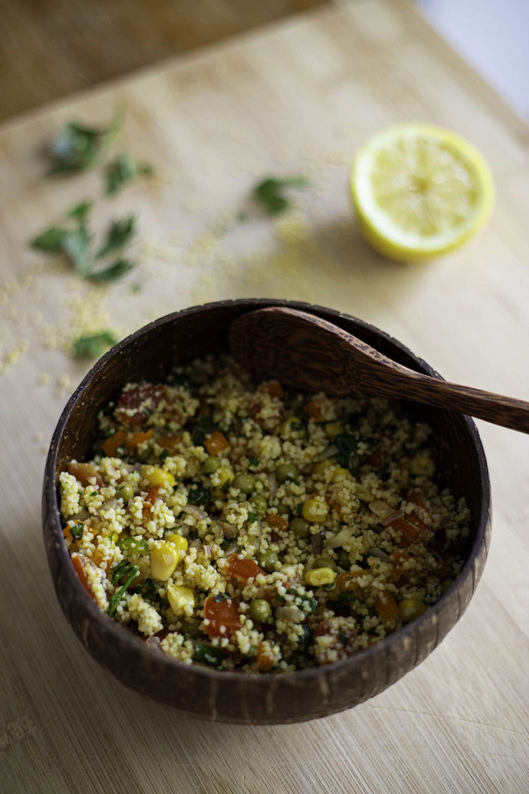 veggie couscous salad with corn, peas, tomatoes, orange bell eppper, green chili pepper, shallots, lemon