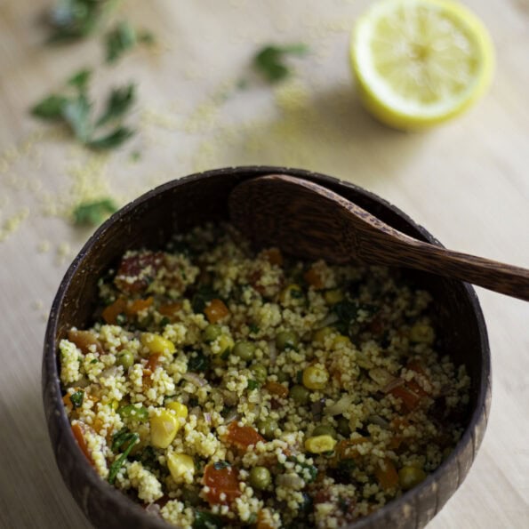 veggie couscous salad with corn, peas, tomatoes, orange bell eppper, green chili pepper, shallots, lemon