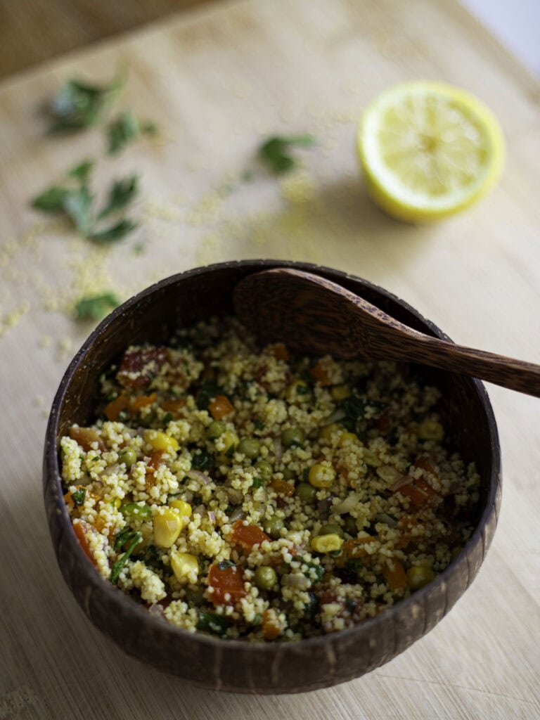 veggie couscous salad with corn, peas, tomatoes, orange bell eppper, green chili pepper, shallots, lemon