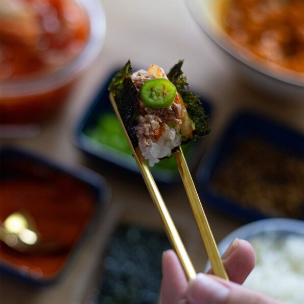 Spicy tuna bite wrapped in a small nori sheet