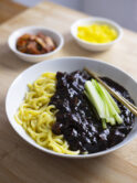 Jjajangmyeon (Korean thick noodles with glossy black bean sauce)