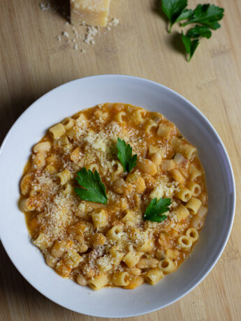 Creamy pasta e fagioli in a orangey, creamy broth made with veggies and pancetta