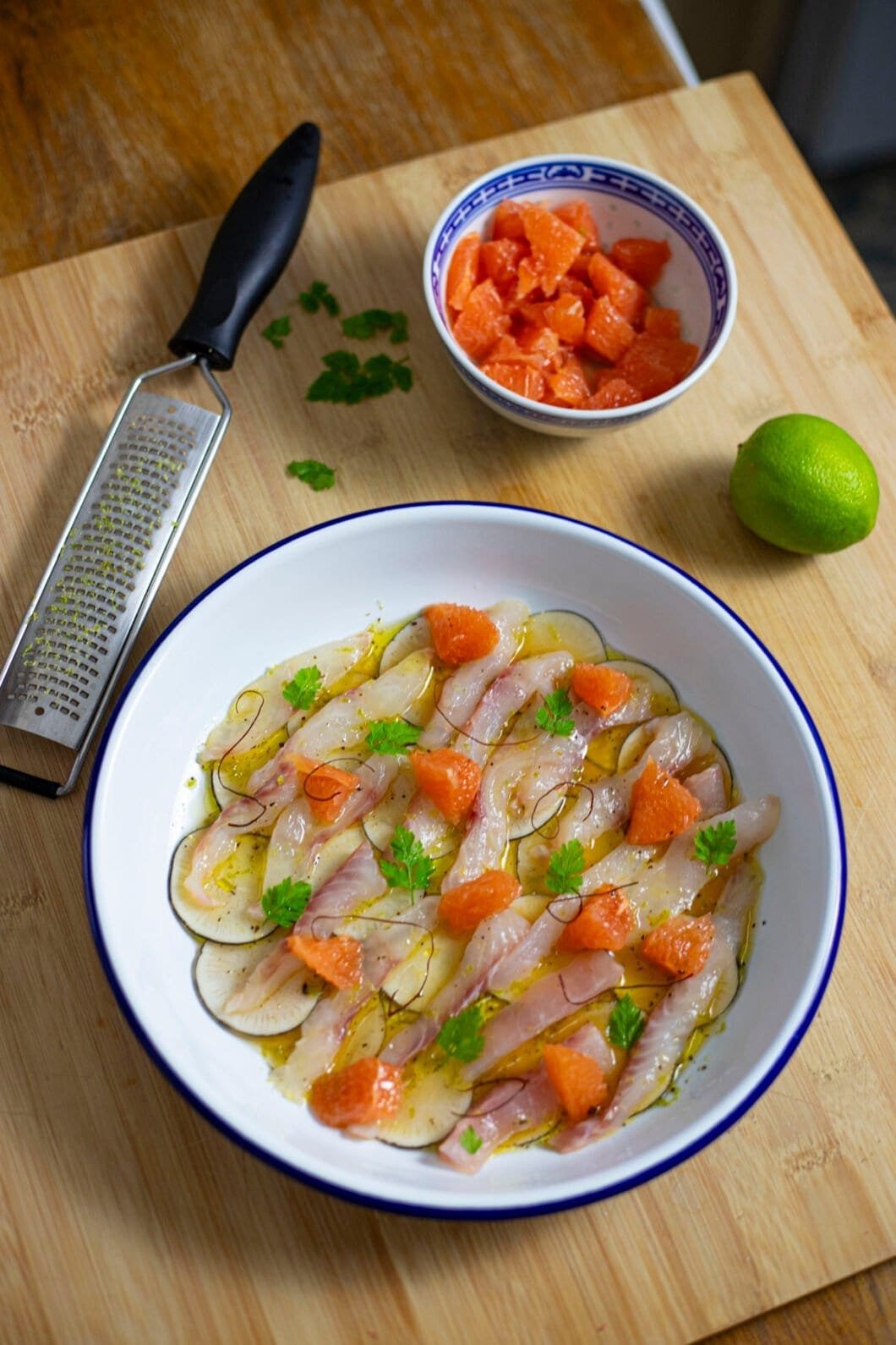 Fish crudo with citruses, radishes and grapefruit segments