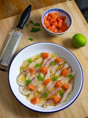 Fish crudo with citruses, radishes and grapefruit segments