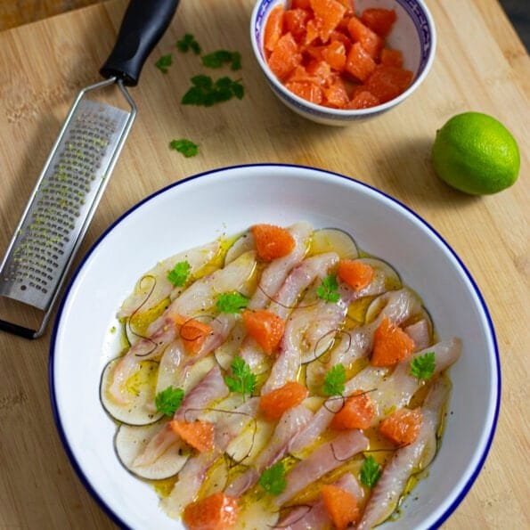 Fish crudo with citruses, radishes and grapefruit segments