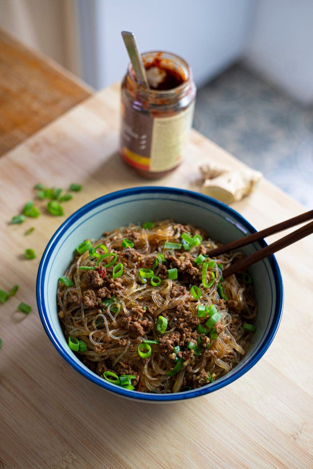 Bowl of noodles with ground beef and chili bean paste (doubanjiang) topped with scallions