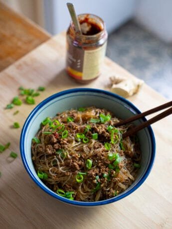 Bowl of noodles with ground beef and chili bean paste (doubanjiang) topped with scallions