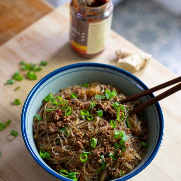 Bowl of noodles with ground beef and chili bean paste (doubanjiang) topped with scallions