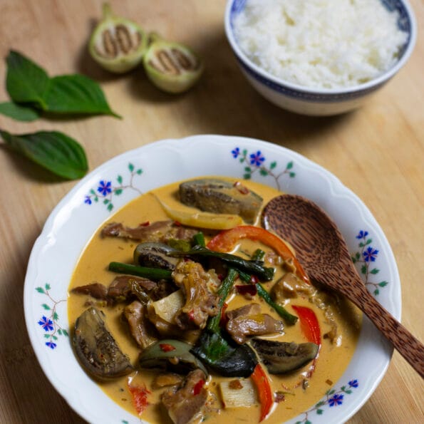 Thai red curry with chicken and vegetables, and a bowl of rice