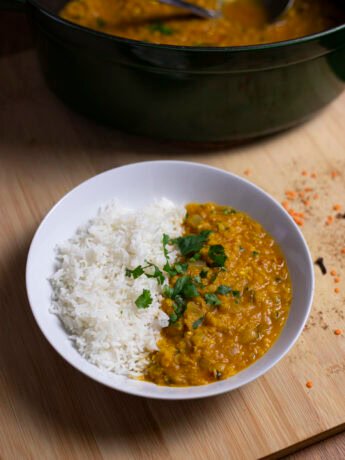Red lentil stew (masoor dal) with basmati rice, topped with cilantro
