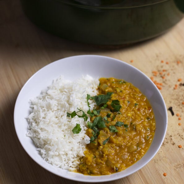 Red lentil stew (masoor dal) with basmati rice, topped with cilantro