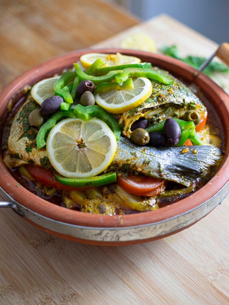 Sea bream tagine with vegetables, olives and lemon