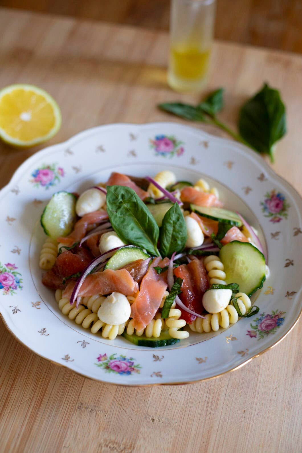 Salmon pasta salad with mozzarella, cucumber, tomatoes, red onions and basil