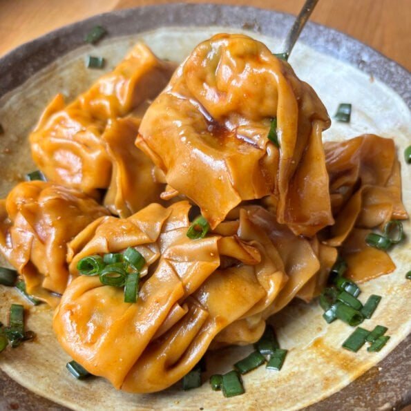 Juicy pork wontons tossed in a glossy soy sauce dressing with scallions. Fast, comforting and ridiculously satisfying.