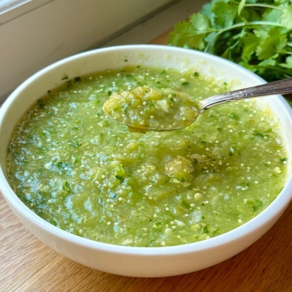 homemade Mexican salsa verde made with tomatillos, green chilies, onion and cilantro