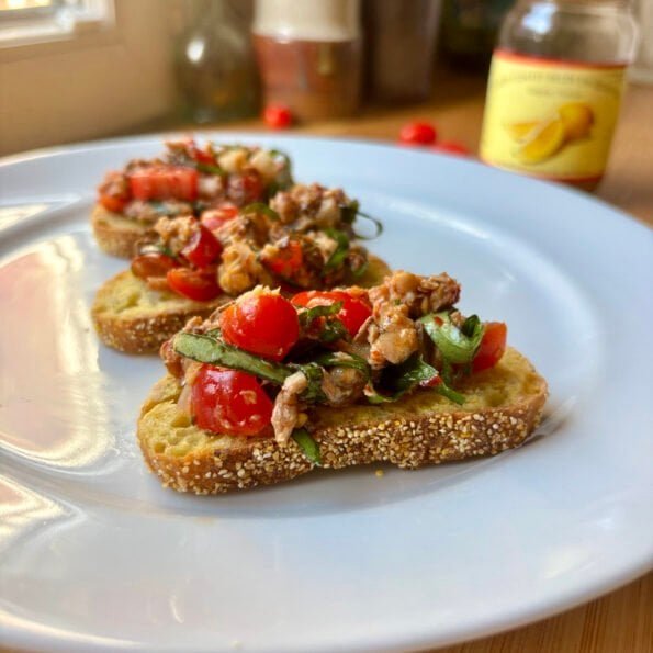 toasts with a sardine and tomatoes mixture
