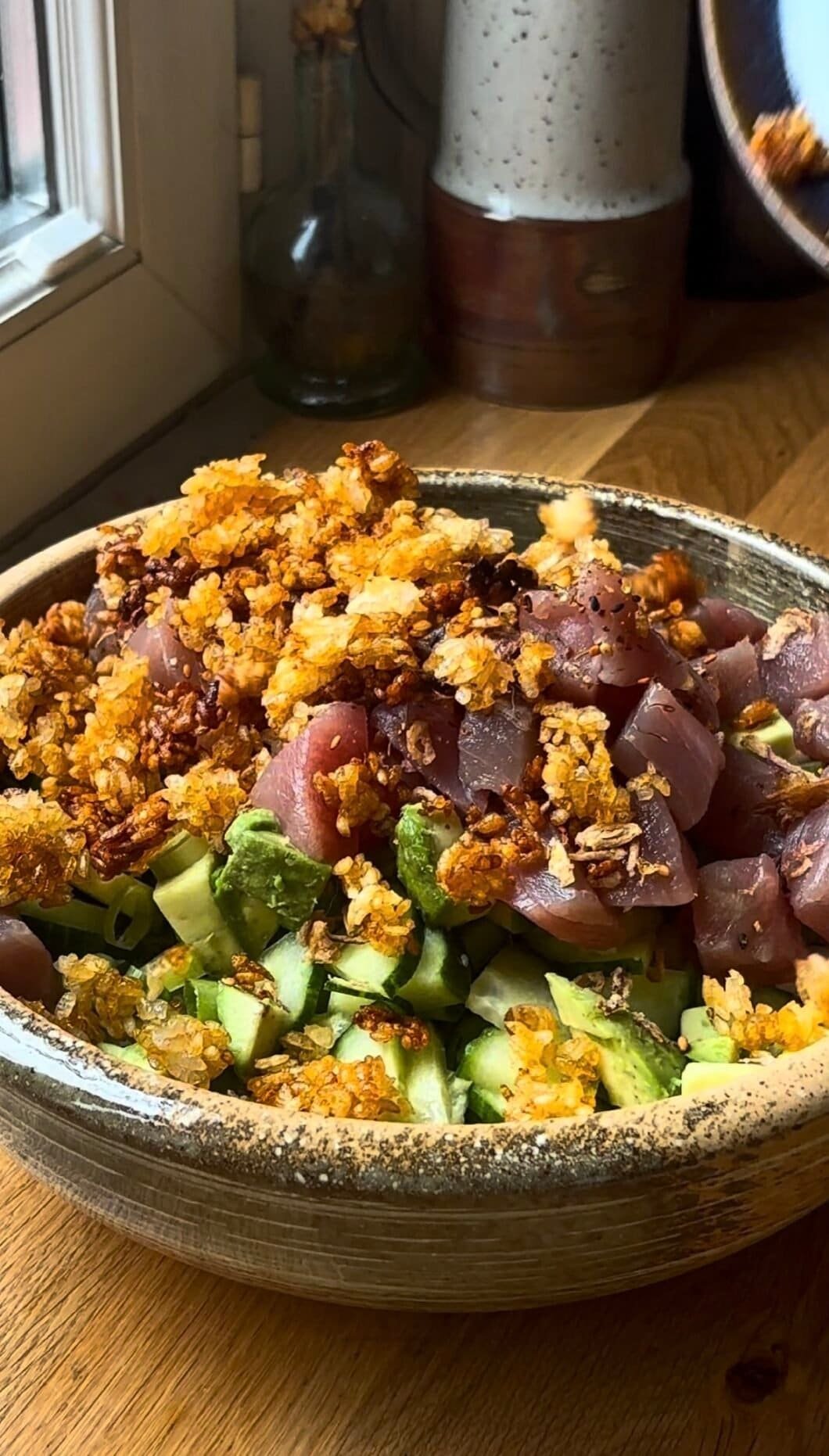Crispy raw tuna salad with crunchy rice cucumber avocado