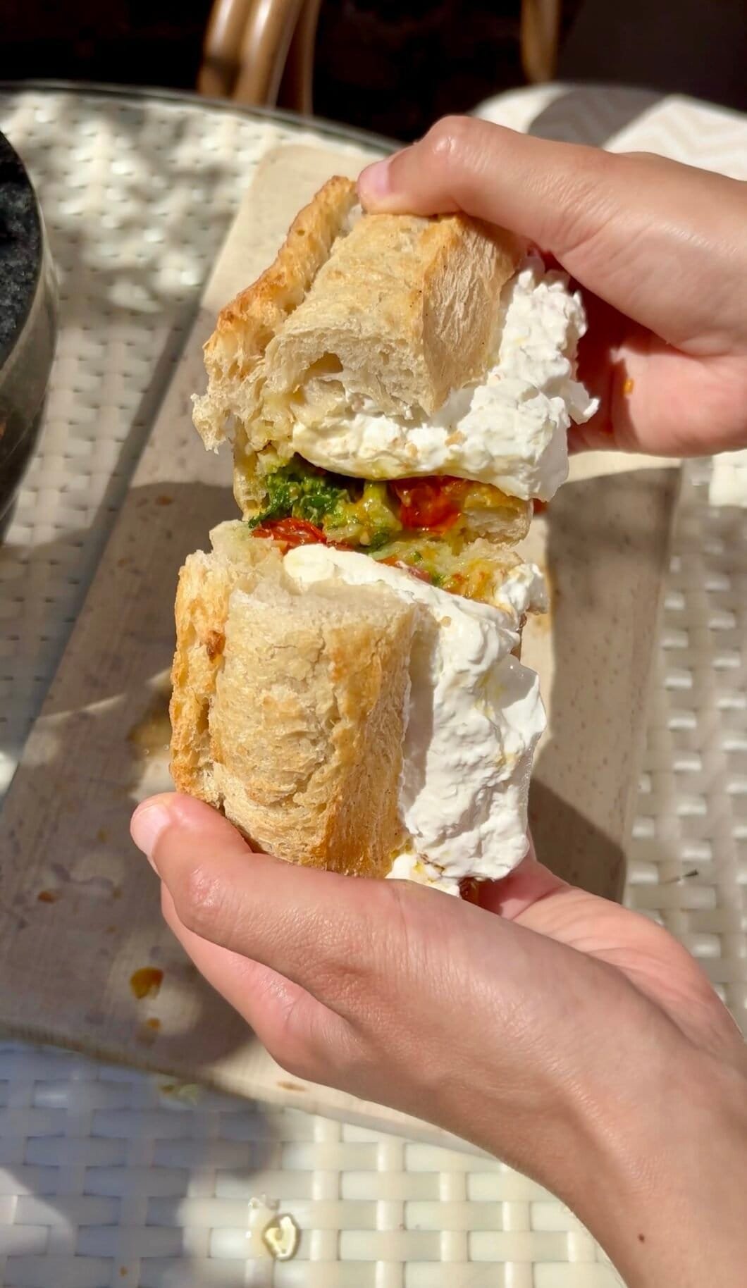 Burrata sandwich with confit tomatoes and pesto