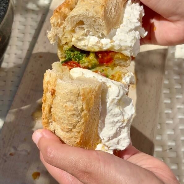 Burrata sandwich with confit tomatoes and pesto