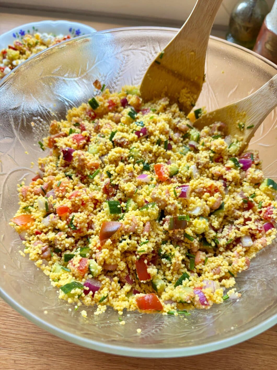 Couscous salad with onion, tomatoes, cucumber, chives and shrimps