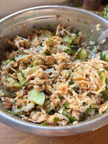 Chicken Rice Salad with cucumbers, fresh herbs, crispy onions and a light hoisin-chicken juice dressing