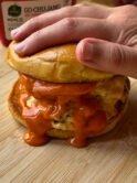 Spicy smash burger with two patties and lots of shiny Gochujang mayo