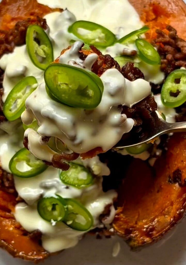 Roasted sweet potato with melted cheddar cream and jalapenos
