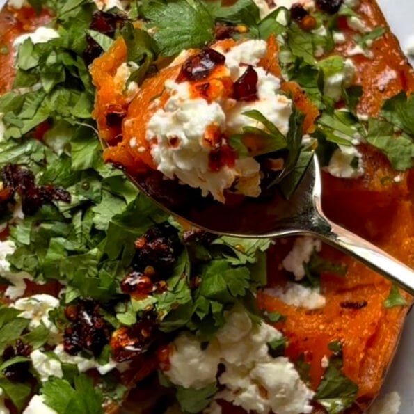 Veggie loaded sweet potato with feta cheese, lime and cilantro