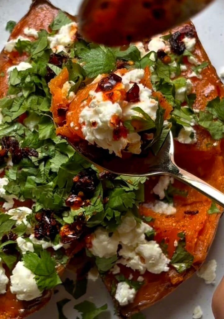 Veggie loaded sweet potato with feta cheese, lime and cilantro