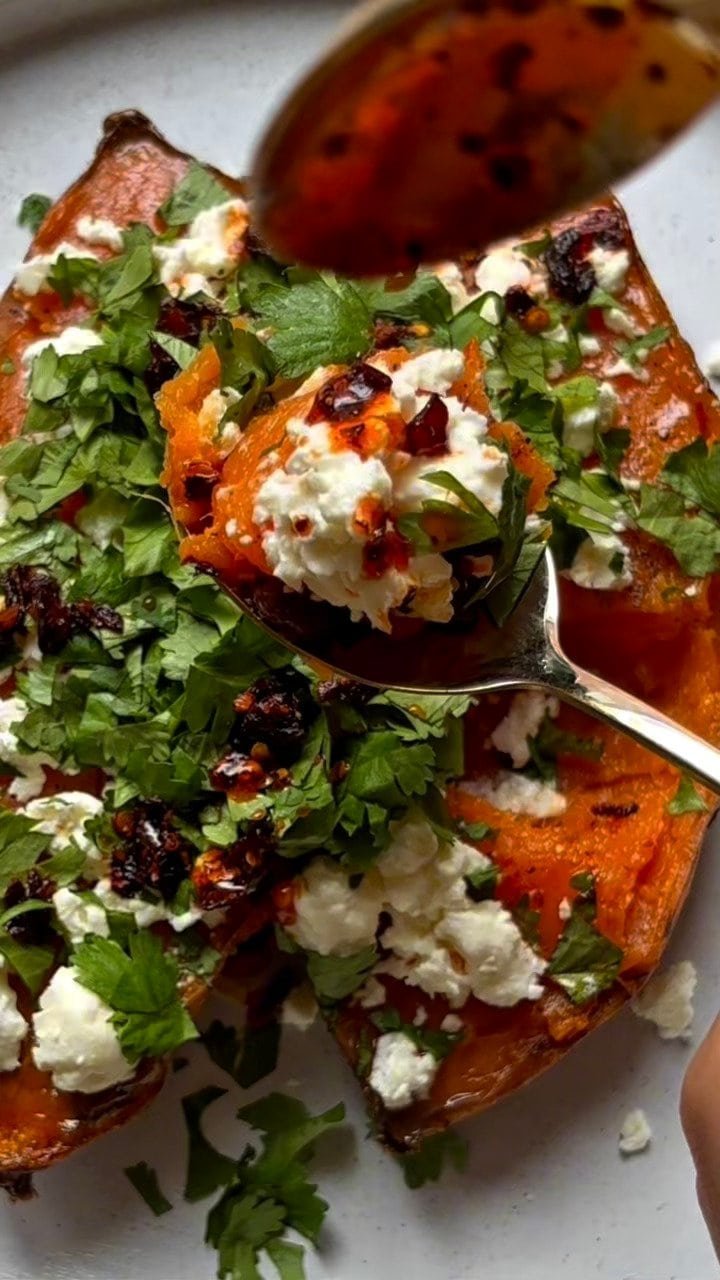 Veggie loaded sweet potato with feta cheese, lime and cilantro